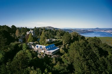 Larnach Lodge is situated on the grounds of Larnach Castle. Dunedin city can be seen down the harbour